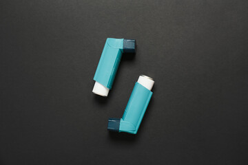Modern inhalers on dark background