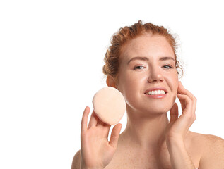 Beautiful young woman with makeup sponge on white background