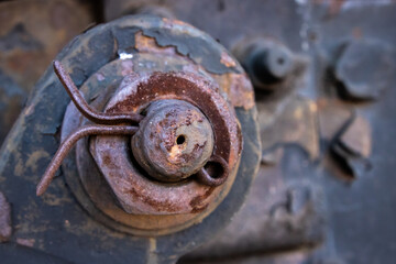 Closeup of a rusty element of a steam locomotive with cotter pin