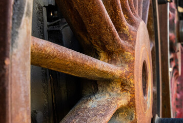 Rusty wheel of an old steam locomotive