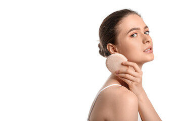 Beautiful young woman with makeup sponge on white background