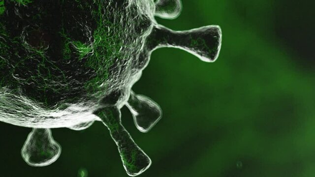 CGI close up of mutating virus cell pulsating against green background