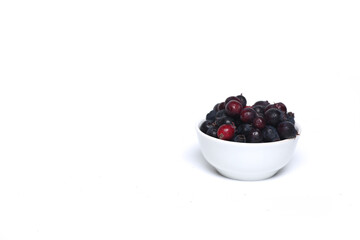 a bowl of shadberry isolated on white background. Farming concept