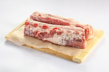 Raw pork ribs over board