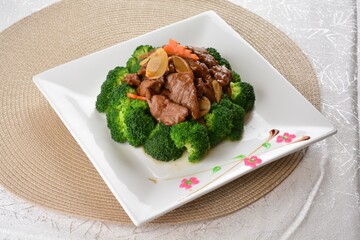 wok stir fried slices meat duck, pork, beef, chicken in soy sauce with broccoli vegetable asian halal menu