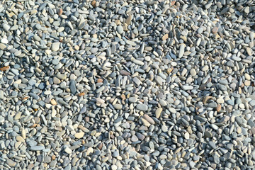 Marine pebble stones. Closeup. Background.  Sea beach. 