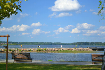 Lake promenade in sunny summer day. Beautiful landscape. Horizontal view. Wallpaper. Travelling.   