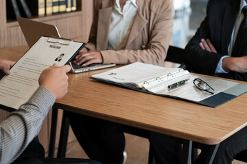Fototapeta premium Examiner reading a resume during job interview at office Business and human resources concept