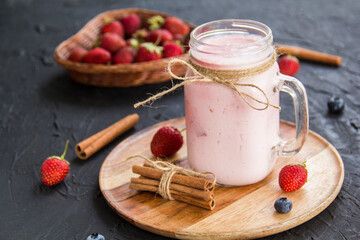 Healthy smoothie of fresh summer berries. Creative atmospheric decoration