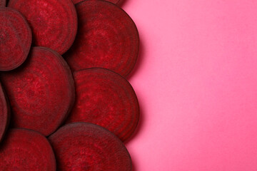 Chopped ripe red beet on pink background