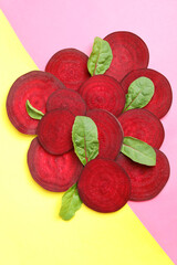 Ripe red beet with leaves on two tone background