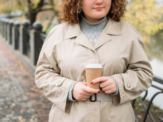 Outdoors leisure. Coffee to go. Body positive. Takeaway drink. Unrecognizable smiling overweight...