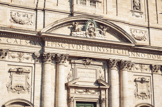 Closeup details on front facade of Santa Maria in Vallicella, also called Chiesa Nuova, a Baroque architecture style church in Rome, Italy
