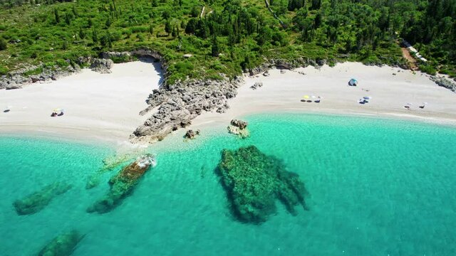 Turquoise sea water on sandy beaches in Albania, near Dhermi. Ideal sea bays for swimming, relaxation and vacations. Aerial view of Albaian nature