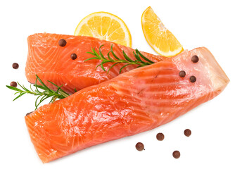 Red fish. Raw salmon fillet with rosemary, peppercorns and lemon isolate on white background....