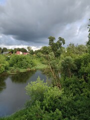 Fototapeta premium river, green and clouds