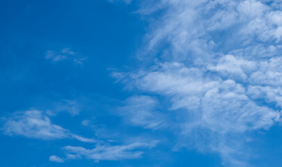 Beautiful blue sky and white cirrocumulus clouds. Background. Scenery. Texture. - obrazy, fototapety, plakaty