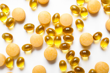 Vitamin K pills on light background, closeup