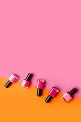 Nail polishes on color background