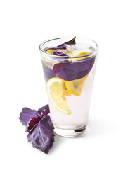 Glass of tasty lemonade with basil on white background