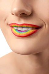 Obraz premium Beautiful young woman with rainbow lips, closeup