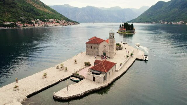 Flying around Our Lady of the Rocks island, Perast, Bay of Kotor, Montenegro. Aerial view of St. George and Gospa od Skrpela islands