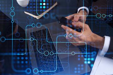Programmer holding in the hands a smart phone and testing an innovative application to provide a completely new service. Close up shot. Hologram tech graphs. Concept of Dev team. Formal wear.