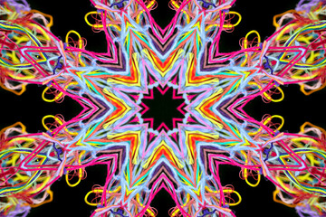 Abstract pattern of multicolored threads on a black background