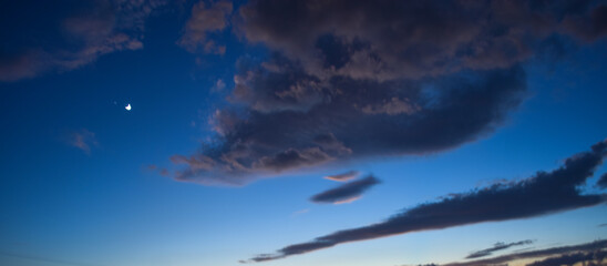 Naklejka na ściany i meble Close up clouds landscape wallpaper, dark sky natural view, sunset bright weather