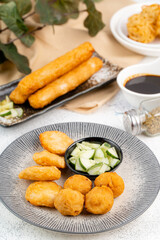 Pempek or empek-empek is a savoury Indonesian fishcake delicacy, made of fish and tapioca, from Palembang South Sumatera, Indonesia. Pempek is served with rich sweet and sour sauce called kuah cuko