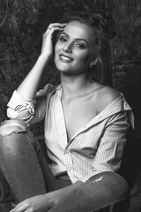 Studio portrait of a happy woman wears jeans and shirt