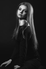 Black and white portrait of an amazing woman with bare shoulders