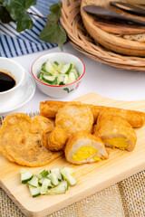 Pempek or empek-empek is a savoury Indonesian fishcake delicacy, made of fish and tapioca, from Palembang South Sumatera, Indonesia. Pempek is served with rich sweet and sour sauce called kuah cuko