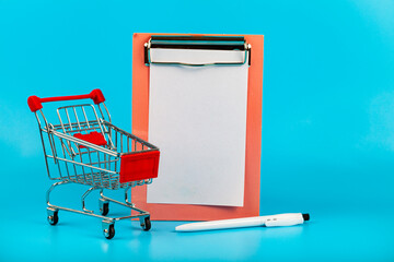 Shopping cart, paper and pen o