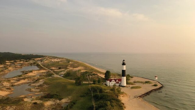 Aerial view of Big Sable Point Lighthouse on the shore of Lake Michigan at sunset.  Ludington State Park, Michigan, USA 