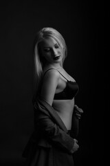 Awesome model wears bra and jacket posing at studio