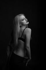 Alluring model wears bra posing at studio