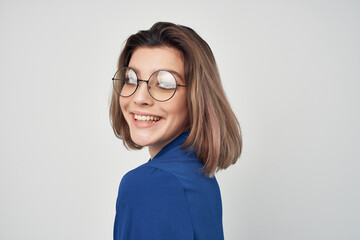 cheerful business woman wearing glasses blue shirt professional office