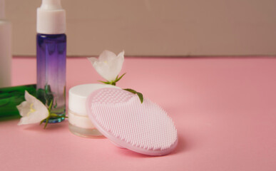 Facial cleansing brush and cosmetics, beauty treatment. Cosmetology and spa. Copy space