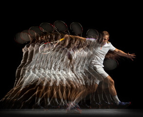 Young man, professional tennis player in motion and action isolated on dark background. Stroboscope...