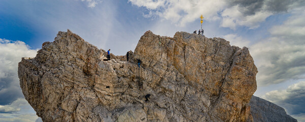 Germany, Bavaria, Zugspitze. Hikers enjoy an inspiring view to the Tirol from the Zugspitze summit...