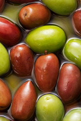 a lot of ripe shiny olives as background