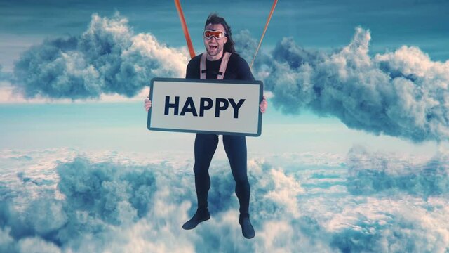 Friendly parachutist with Happy placard