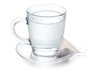 hot water in glass and teabag on white background