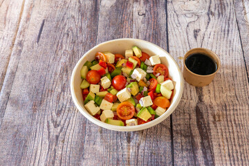 Turkish chopped vegetable salad. Cherry tomatoes, ripe avocados, feta cheese, red peppers and green...