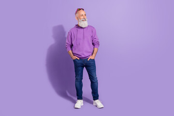 Full length body size view of attractive cheerful grey-haired man thinking copy space isolated over purple violet color background