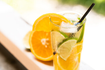 Orange and lime drink. Refreshing cold summer fruit drink. Vegan drink, healthy food, natural healthy lifestyle.