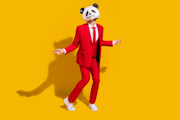 Photo of careless disco panda guy dance have fun wear mask red suit tie sneakers isolated on yellow color background