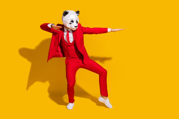 Photo of modern dancer panda guy dance move wear mask red tuxedo tie shoes isolated on yellow color background - obrazy, fototapety, plakaty