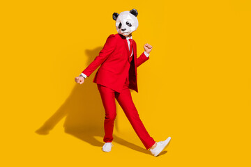 Photo of freak panda guy enjoy funky discotheque motion wear mask red tuxedo shoes isolated on...